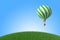 Green-white Hot Air Balloon in the blue sky