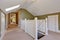 Green and white upstairs hallway with vaulted ceiling and skylight