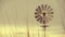 Green wind energy: vintage running farm windmill at sunset