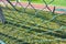 Green wire fence at the football pitch close up view