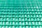 Green wired net surface with blurred background. Advertising backdrop