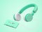 Green wireless headphones link cassette tapes , 3d rendering