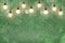 Green wonderful sparkling glitter lights defocused light bulbs bokeh abstract background with sparks fly, festive mockup texture
