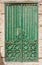 Green wood and iron pattern door