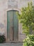 Green wooden door in an old traditional facade