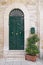 Green wooden frontdoor.