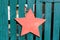 Green wooden gate with red star