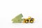 Green wooden house model with front loader truck isolate on white background, clearance sale