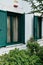 Green Wooden Shutters on White Stucco House, Greece