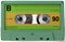 Green and yellow audio cassette with sticker and label