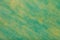 Green and yellow background of felt fabric. Texture of woolen textile