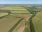 Green and yellow fields before harvesting. Top aerial view made by drone