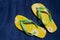 Green and yellow flip-flops