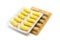 Green yellow herb capsules pills in gold silver blister pack