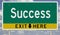 Green and yellow highway sign for SUCCESS