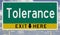 Green and yellow highway sign for TOLERANCE