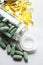 Green and yellow medicines on a steel table