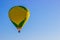 Green & Yellow Patterned Hot Air Balloon In Early Morning