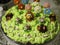 Green yellow tasty cake with funny animals figurines. Happy kids birthday