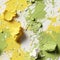 Green, yellow, and white paint splashes with organic sculpting (tiled)
