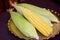 Green and yellow Young corn on Gold tray