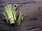 Green young asparagus sprouts on wooden table. Top view