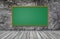 Greenboard on wall with wooden table