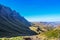 Greenery in Sani pass under blue sky near kingdom of Lesotho Sou