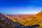 Greenery in Sani pass under blue sky near kingdom of Lesotho Sou