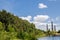 Greenery of Wetland in cloudy day with water pond view and brick kilns and chimneys at Sydney Park, Australia.