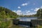 Greenery of Wetland in cloudy day with water pond view and brick kilns and chimneys at Sydney Park, Australia.