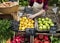 Greengrocer preparing organic fresh agricultural product at farmer market