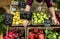 Greengrocer preparing organic fresh agricultural product at farmer market