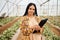 Greenhouse, agriculture portrait and black woman with vegetables inspection, agro business and food supply chain