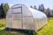 Greenhouse. Bright greenhouse in the garden. Indoor stationary greenhouse
