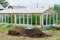 Greenhouse and heap of manure