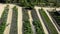 Greenhouses top view. Garden beds near the house. Smooth long beds with vegetables, berries and shrubs in the country in summer