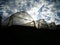 Greenhouses under a cloudy sky