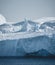 Greenland. The biggest glacier on a planet Jakobshavn. Huge icebergs of different forms in the gulf. Studying of a