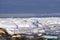 Greenland glacier glaciers houses ocean small town burg sky
