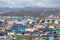 Greenland view of colorful houses in Ilulissat City and icefjord. Tourist destination in the arctic.