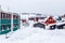 Greenlandic Inuit houses among covered in snow a suburb of arct