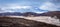 Greenlandic wastelands landscape with river and mountains in the background, Kangerlussuaq, Greenland