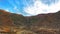 greenry mountain with cloud and rocks