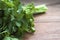 Greens in a bunch, parsley  knitted elastic band on a wooden table