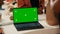 Greenscreen isolated display on laptop at farmers market,