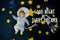 Greeting card with the inscription Good Night and Sweet Dreams. Little boy baby sleeping astronaut