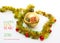 Greeting card made of yellow and green tinsel frame with red and golden christmas balls and chinese hieroglyph for monkey