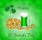 Greeting card for St. Patrick`s Day with a mug of green beer, gold coins and clover leaves