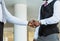 Greeting and handshake of two afro american businessmen partner against the backdrop of a modern building exterior